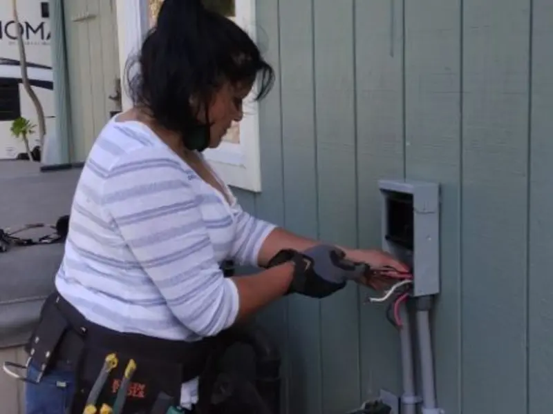 Licensed electrician wiring an exterior subpanel in Worth