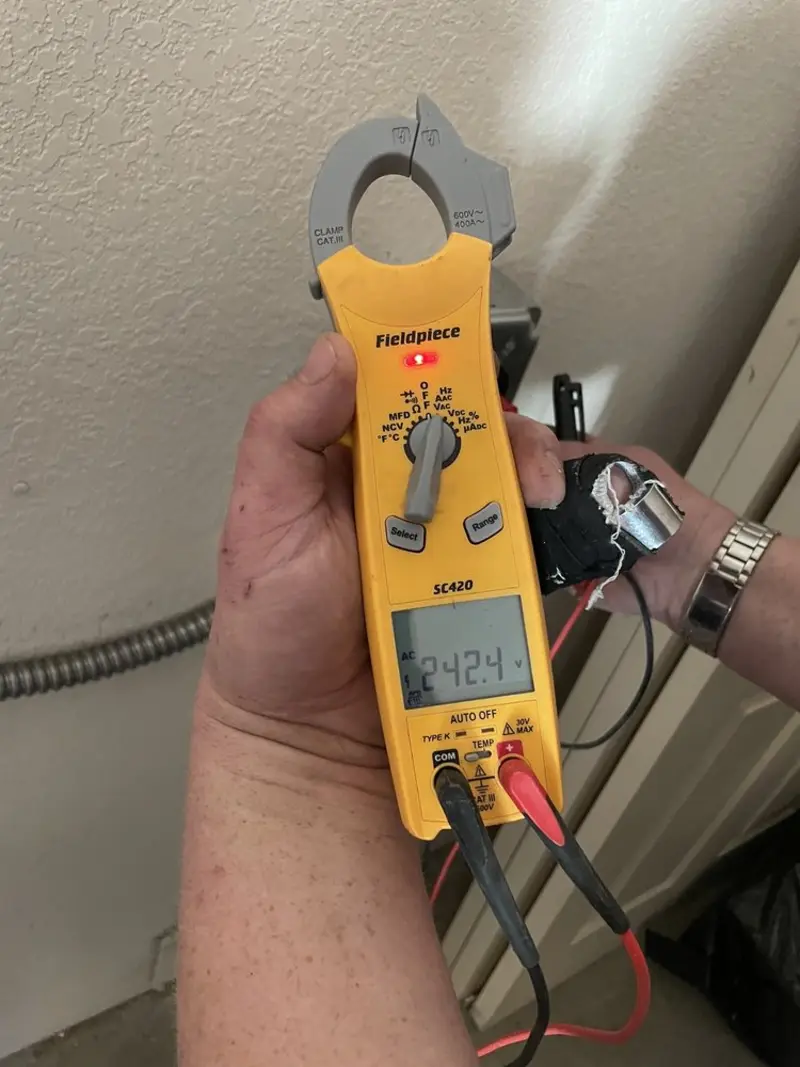 Voltage testing with clamp meter during Ceiling Fan Installation in Worth